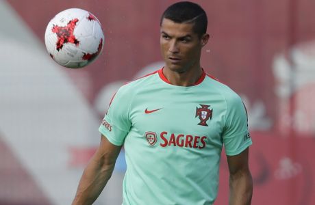 Portugal's Cristiano Ronaldo attends a training session at the Rubin Training Ground in Kazan, Russia, on Friday, June 16, 2017. Portugal will play Mexico in the Confederations Cup, Group A soccer match scheduled for Sunday, June 18, 2017. (AP Photo/Sergei Grits)