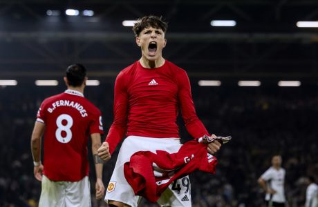 Manchester United's Alejandro Garnacho celebrates scoring his last minute win during the Premier League soccer match between Fulham and Manchester United at Craven Cottage in London, England, Sunday November 13th, 2022. (AP Photo/Leila Coker)