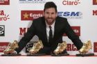 FILE - In this file photo dated Friday, Nov 24, 2017, FC Barcelona's Lionel Messi poses after receiving his fourth Golden Shoe award for leading all of Europe's leagues in scoring last season in Barcelona, Spain.  Messi has signed a new contract Saturday Nov. 25, 2017, that will keep the star at the Spanish club for four more years. (AP Photo/Manu Fernandez, FILE)
