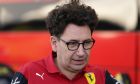 Ferrari team principal Mattia Binotto talks with a crew member in the paddock at the Formula One U.S. Grand Prix auto race at Circuit of the Americas, Thursday, Oct. 20, 2022, in Austin, Texas. (AP Photo/Charlie Neibergall)