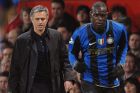 Inter Milan manager Jose Mourinho (left) watches his player Mario Balotelli (right) from the touchline.