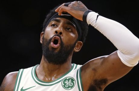 Boston Celtics guard Kyrie Irving reacts during the first quarter of a preseason basketball game against the Charlotte Hornets in Boston, Sunday, Sept. 30, 2018. (AP Photo/Charles Krupa)