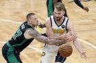 Boston Celtics' Daniel Theis, left, knocks the ball away from Indiana Pacers' Domantas Sabonis during the third quarter in Game 1 of a first-round NBA basketball playoff series, Sunday, April 14, 2019, in Boston. (AP Photo/Winslow Townson)