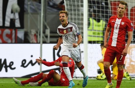 Germany's forward Mario Goetze (C) celebrates scoring during the Euro 2016 qualifying football match between Germany and Poland in Frankfurt am Main, central Germany, on September 4, 2015.   AFP PHOTO / PATRIK STOLLARZ        (Photo credit should read PATRIK STOLLARZ/AFP/Getty Images)