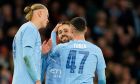 Manchester City's Bernardo Silva, centre, celebrates with his teammates after scoring his side's second goal during the FA Cup quarterfinal soccer match between Manchester City and Newcastle at the Etihad Stadium in Manchester, England, Saturday, March 16, 2024. (AP Photo/Dave Thompson, Pool)