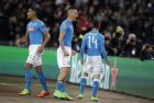 Napoli's Marek Hamsik, center, celebrates after Dries Mertens, right,scored the opening goal during the Champions League round of 16, second leg, soccer match between Napoli and Real Madrid at the San Paolo stadium in Naples, Italy, Tuesday March 7, 2017. (AP Photo/Andrew Medichini)