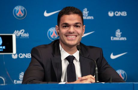 French soccer player Hatem ben Arfa smiles during a press conference after signing with the team, at the Parc des Princes stadium in Paris, Monday, July 4, 2016. (AP Photo/Kamil Zihnioglu) 