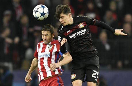 Atletico's Gabi, left, and Leverkusen's Kai Havertz go for a header during the Champions League round of 16 first leg soccer match between Bayer Leverkusen and Atletico Madrid in Leverkusen, Germany, Tuesday, Feb. 21, 2017. (AP Photo/Martin Meissner)