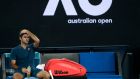 Switzerland's Roger Federer sits in his chair during a break in his fourth round match against Greece's Stefanos Tsitsipas at the Australian Open tennis championships in Melbourne, Australia, Sunday, Jan. 20, 2019. (AP Photo/Mark Schiefelbein)