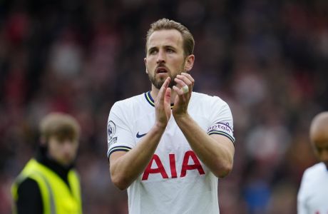 Tottenham's Harry Kane applauds fans after his team lost 4-3 at the end of an English Premier League soccer match between Liverpool and Tottenham Hotspur at Anfield stadium in Liverpool, Sunday, April 30, 2023. (AP Photo/Jon Super)