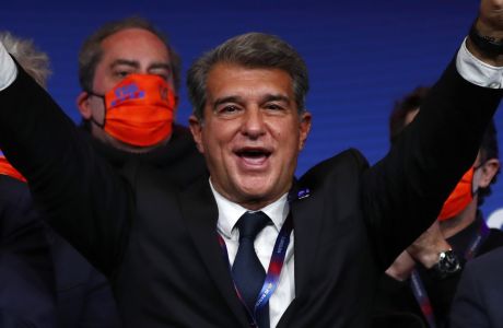 FILE - Joan Laporta celebrates his victory after elections at the Camp Nou stadium in Barcelona, Spain, Sunday, March 7, 2021. The European Unions top court has ruled UEFA and FIFA acted contrary to EU competition law by blocking plans for the breakaway Super League. The case was heard last year at the Court of Justice after Super League failed at launch in April 2021. UEFA President Aleksander Ceferin called the club leaders snakes and liars. (AP Photo/Joan Monfort, File)