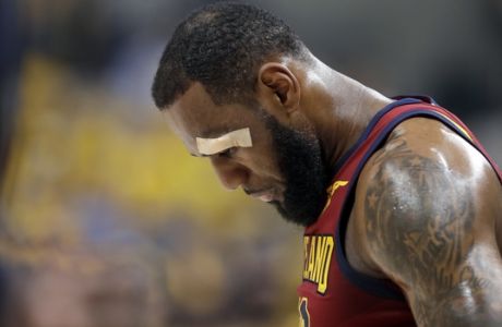 Cleveland Cavaliers' LeBron James remains in the game after sustaining a cut above his left eye on a drive to the basket during the first half of Game 6 of a first-round NBA basketball playoff series against the Indiana Pacers, Friday, April 27, 2018, in Indianapolis. (AP Photo/Darron Cummings)