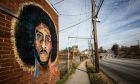 A mural depicting embattled NFL quarterback Colin Kaepernick is seen on a wall on Monday, Feb. 4, 2019, in Atlanta. Several such murals were hastily painted over the weekend across the Super Bowl host town in protest after one that had stood for two years was abruptly demolished on the eve of the big game. (AP Photo/ Ron Harris)