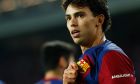 Barcelona's Joao Felix celebrates after scoring his side's second goal during the Champions League Group H soccer match between Barcelona and Porto at the Olympic Stadium in Barcelona, Spain, Tuesday, Nov. 28, 2023. (AP Photo/Joan Monfort)