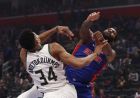 Detroit Pistons center Andre Drummond (0) attempts a shot as Milwaukee Bucks forward Giannis Antetokounmpo (34) defends during the second half of Game 3 of a first-round NBA basketball playoff series, Saturday, April 20, 2019, in Detroit. (AP Photo/Carlos Osorio)