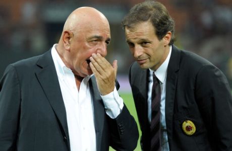 MILAN, ITALY - AUGUST 21:  AC Milan AD Adriano Galliani and head coach Massimiliano Allegri talk during the Berlusconi Trophy match between AC Milan and Juventus FC at Giuseppe Meazza Stadium on August 21, 2011 in Milan, Italy.  (Photo by Claudio Villa/Getty Images)