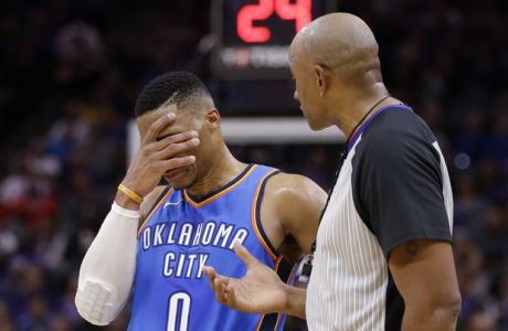 Oklahoma City Thunder guard Russell Westbrook covers his face as he discusses a foul call with referee Kevin Cutler during the second half of an NBA basketball game against the Sacramento Kings, Tuesday, Nov. 7, 2017, in Sacramento, Calif. The Kings won 94-86. (AP Photo/Rich Pedroncelli)