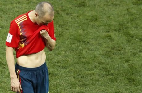 Spain's Andres Iniesta leaves the pitch after the round of 16 match between Spain and Russia at the 2018 soccer World Cup at the Luzhniki Stadium in Moscow, Russia, Sunday, July 1, 2018. Russia eliminates Spain 4-2 on penalties after game ends 1-1. (AP Photo/David Vincent)