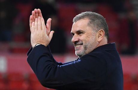 Tottenham's head coach Ange Postecoglou applaud supporters at the end of the English Premier League soccer match between Nottingham Forest and Tottenham Hotspur at City ground in Nottingham, England, Friday, Dec. 15, 2023. (AP Photo/Rui Vieira)