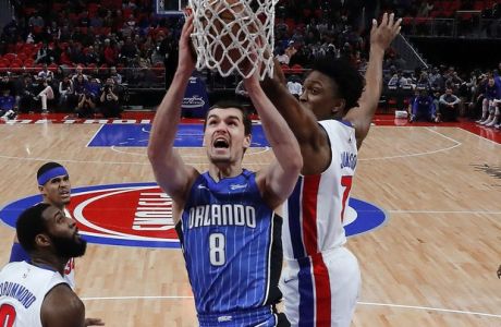 Orlando Magic guard Mario Hezonja (8) drives to the basket against the Detroit Pistons in the first half of an NBA basketball game in Detroit, Sunday, Dec. 17, 2017. (AP Photo/Paul Sancya)
