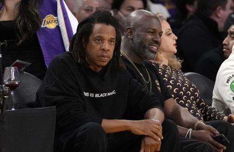 JAY-Z, left, watches during the first half of an NBA basketball game between the Los Angeles Lakers and the Oklahoma City Thunder Tuesday, Feb. 7, 2023, in Los Angeles. (AP Photo/Ashley Landis)