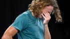 Greece's Stefanos Tsitsipas reacts after defeating Switzerland's Roger Federer in their fourth round match at the Australian Open tennis championships in Melbourne, Australia, Sunday, Jan. 20, 2019. (AP Photo/Andy Brownbill)