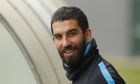 FC Barcelona's Arda Turan attends a training session at the Sports Center FC Barcelona Joan Gamper in San Joan Despi, Spain, Tuesday, March 15, 2016.  FC Barcelona will play against Arsenal in a Champions League Group E soccer match on Wednesday March 16. (AP Photo/Manu Fernandez)