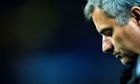 Real Madrid's coach Jose Mourinho from Portugal reacts during his team's 5-0 loss against FC Barcelona during a Spanish La Liga soccer match at the Camp Nou stadium in Barcelona, Spain, Monday, Nov. 29, 2010. (AP Photo/Manu Fernandez)