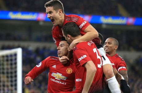 Manchester United midfielder Jesse Lingard, with his teammates celebrates his goal against Cardiff City during the English Premier League match between Cardiff City and Manchester United at the Cardiff City Stadium in Cardiff, Wales, Saturday Dec. 22, 2018. (AP Photo/ Jon Super)