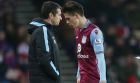 Aston Villa's manager Remi Garde, left, and  Jack Grealish, right, during the English Premier League soccer match between Sunderland and Aston Villa at the Stadium of Light, Sunderland, England, Saturday, Jan. 2, 2016. (AP Photo/Scott Heppell)