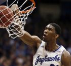 Kansas center Joel Embiid dunks during the first half of an NCAA college basketball game against Texas in Lawrence, Kan., Saturday, Feb. 22, 2014. (AP Photo/Orlin Wagner)