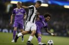 Real Madrid's Marcelo, right, challenges for the ball with Juventus' Paulo Dybala during the Champions League final soccer match between Juventus and Real Madrid at the Millennium Stadium in Cardiff, Wales, Saturday June 3, 2017. (AP Photo/Kirsty Wigglesworth)