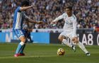 Real Madrid's Cristiano Ronaldo, right, vies for the ball with Deportivo Coruna's Juanfran Moreno during a Spanish La Liga soccer match between Real Madrid and Deportivo Coruna at the Santiago Bernabeu stadium in Madrid, Sunday, Jan. 21, 2018. Ronaldo scored twice in Real Madrid's 7-1 victory. (AP Photo/Francisco Seco)
