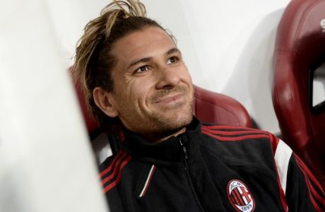AC Milan's Alessio Cerci sitting on the bench during a Serie A soccer match between Torino and AC Milan at the Olympic stadium, in Turin, Italy, Saturday, Jan. 10, 2015. (AP Photo/Massimo Pinca)