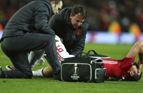 Manchester United's Zlatan Ibrahimovic is checked before being taken off with an injury during the Europa League quarterfinal second leg soccer match between Manchester United and Anderlecht at Old Trafford stadium, in Manchester, England, Thursday, April 20, 2017. (AP Photo/Dave Thompson)