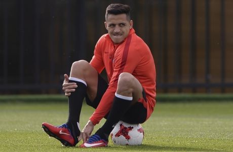 FILE - In this Saturday, June 24, 2017 file photo Chile's Alexis Sanchez attends a training session at the FC Strogino Stadium in Moscow, Russia.  Alexis Sanchez said Friday June 30, 2017  hes reached a decision on his future at Arsenal, but wont reveal it until after Sundays Confederations Cup final. (AP Photo/Daria Isaeva, file)