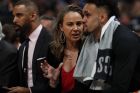 San Antonio Spurs assistant coach Becky Hammon, center, confers with San Antonio Spurs guard Derrick White (4) in the first half of Game 1 of an NBA first-round basketball playoff series Saturday, April 13, 2019, in Denver. (AP Photo/David Zalubowski)