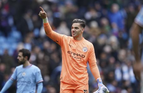 Manchester City's goalkeeper Ederson celebrates at the end of the English Premier League soccer match between Manchester City and and Newcastle, at the Etihad stadium in Manchester, England, Saturday, March 4, 2023. (AP Photo/Dave Thompson)