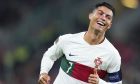 FILE - Portugal's Cristiano Ronaldo celebrates after Portugal's Diogo Dalot scored their side's third goal during the UEFA Nations League soccer match between the Czech Republic and Portugal at the Sinobo stadium in Prague, Czech Republic, Saturday, Sept. 24, 2022. (AP Photo/Petr David Josek, File)
