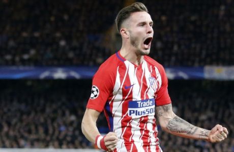 Atletico's Saul Niguez celebrates scoring his side's first goal during the Champions League Group C soccer match between Chelsea and Atletico Madrid at Stamford Bridge stadium in London Tuesday, Dec. 5, 2017. (AP Photo/Frank Augstein)