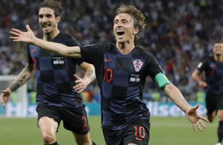 Croatia's Luka Modric, right, celebrates with teammates after scoring his side's second goal during the group D match between Argentina and Croatia at the 2018 soccer World Cup in Nizhny Novgorod Stadium in Nizhny Novgorod, Russia, Thursday, June 21, 2018. (AP Photo/Ricardo Mazalan)