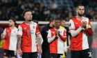 Feyenoord's David Hancko, right, and Feyenoord's Quilindschy Hartman, front left, are seen after the end of the Europa League play off, first leg soccer match between Feyenoord and Roma at De Kuip stadium in Rotterdam, Netherlands, Thursday, Feb. 15, 2024. The match ended 1-1. (AP Photo/Peter Dejong)