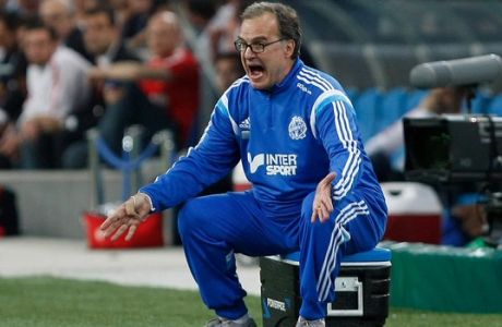 FILE - In this May 10, 2015 file photo, Marseille's coach Marcelo Bielsa, of Argentina, shouts instructions during a League One soccer match between Marseille and Monaco in Marseille, France.  In the latest controversy in his coaching career, Marcelo Bielsa quit as coach of Lazio on Friday, July 8, 2016, just two days after the Italian club announced it signed the former Argentina manager. (AP Photo/Claude Paris, FILE)