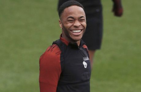 Manchester City's Raheem Sterling smiles, during a training session at the City Football Academy, in Manchester, England, Tuesday March 14, 2017. Manchester City will play Monaco in a second leg Champions League Round of 16 soccer match on Wednesday. (Peter Byrne/ PA via AP)