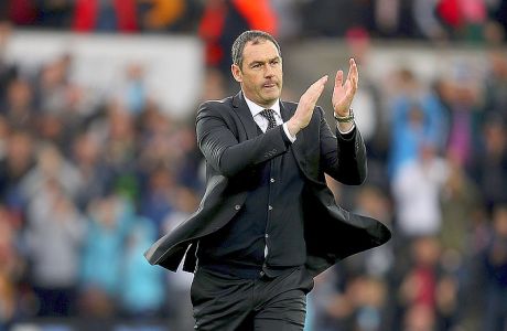 Swansea City manager Paul Clement applauds after the final whistle of the English Premier League soccer match, Swansea City against Everton at the Liberty Stadium, Swansea, Wales,  Saturday May 6, 2017. (David Davies/PA via AP)
