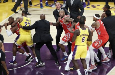 Houston Rockets' Chris Paul, far left, is held back by Los Angeles Lakers' LeBron James, second from left, after Paul fought with Lakers' Rajon Rondo, far right, during the second half of an NBA basketball game Saturday, Oct. 20, 2018, in Los Angeles. The Rockets won, 124-115. (AP Photo/Marcio Jose Sanchez)