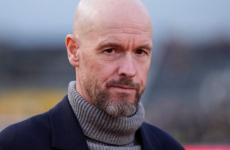 Manchester United's head coach Erik ten Hag, looks at the field before the FA Cup fourth round soccer match between Newport County and Manchester United at the Rodney Parade stadium in Newport, Wales, Sunday, Jan. 28, 2024. (AP Photo/Alastair Grant)