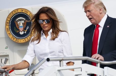 President Donald Trump and first lady Melania Trump arrive on Air Force One at Morristown Municipal Airport, in Morristown, N.J., Friday, July 27, 2018, en route to Trump National Golf Club in Bedminster, N.J. (AP Photo/Carolyn Kaster)