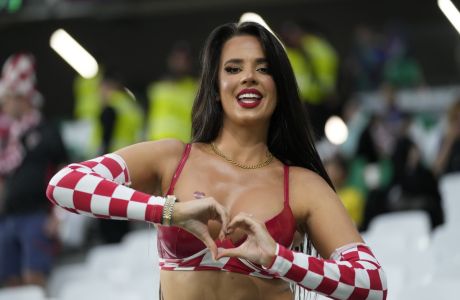 A fan of Croatia poses for a photo ahead of the start of the World Cup quarterfinal soccer match between Croatia and Brazil, at the Education City Stadium in Al Rayyan, Qatar, Friday, Dec. 9, 2022. (AP Photo/Darko Bandic)