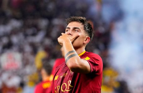 Roma's Paulo Dybala celebrates after scoring the opening goal during the Europa League final soccer match between Sevilla and Roma, at the Puskas Arena in Budapest, Hungary, Wednesday, May 31, 2023. (AP Photo/Petr David Josek)